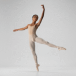 Young ballet dancer practicing gracefully in a professional studio, representing youth ballet programs in Toronto.